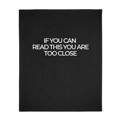 Two-sided printed blanket with "Too close" print