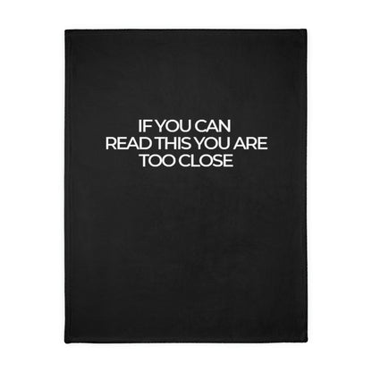 Two-sided printed blanket with "Too close" print