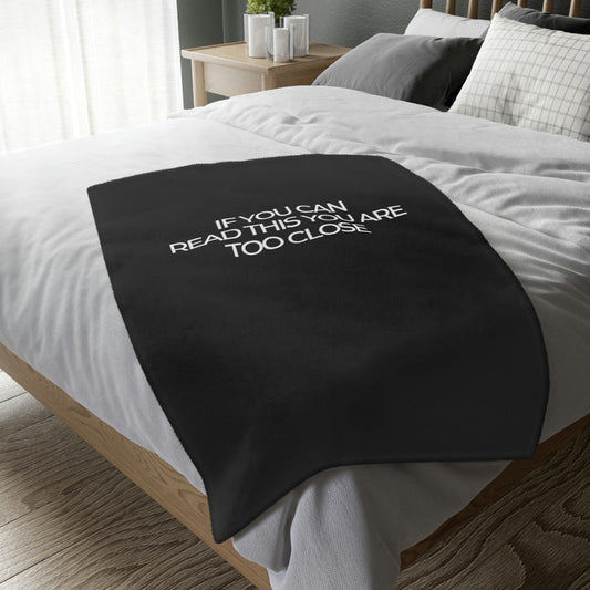 Two-sided printed blanket with "Too close" print