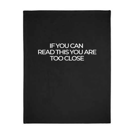 Two-sided printed blanket with "Too close" print
